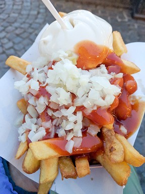 In Belgium, an extra browning and unusual toppings — like mayo with curry ketchup and onions — turn familiar fries into a tasty adventure. (Nikky Southerland)