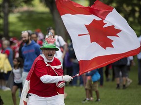 Henry Stephens waves a Canadian flag as he takes part in Canada Day festivities at the Alberta Legislature, in Edmonton Sunday July 1, 2018. (Postmedia file photo)