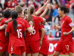 Team Canada captain Christine Sinclair (12) celebrates a goal by midfielder Jessie Fleming (17) during the first half of a women's international soccer friendly against Mexico at BMO field in Toronto, Saturday, May 18, 2019.