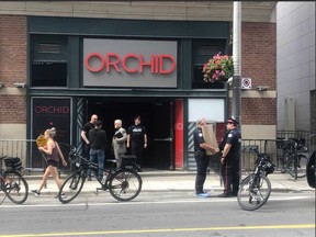 Police at the scene of Sunday morning’s club murder. (Jack Boland, Toronto Sun)