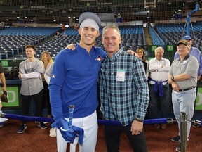Blue Jays’ Cavan Biggio (left) poses with his father and former Astros star Craig, before his May 24 MLB debut in Toronto. (GETTY IMAGES)