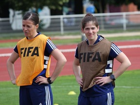 Canadian assistant referee Chantal Boudreau, right, looks on during a drill at the FIFA Referees Media Day at the Institut National du Sport, de l'Expertise et de la Performance (INSEP) in Paris for the upcoming 2019 FIFA Women's World Cup on June 4, 2019.