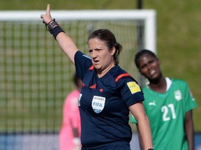 Referee Carol Anne Chenard referees a match between Germany and Cote d'Ivoire's during FIFA Women's World Cup soccer action in Ottawa on Sunday, June 7, 2015.