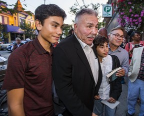 With the help of his son and grandsons, retired boxer George Chuvalo arrives for his 80th birthday party at the Cadillac Lounge along Queen St. W.. in Toronto, Ont. on Tuesday September 12, 2017. From left – grandson Aaron Chuvalo, 13, George Chuvalo, other grandson Elijah Chuvalo, 12, and his son Mitch Chuvalo. (Ernest Doroszuk/Toronto Sun/Postmedia Network)