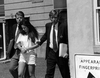 Cops lead Long Island Lolita, Amy Fisher, out of a courthouse in 1992. GETTY IMAGES