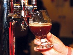 Alexander Pulyanovich, of Norse Brewery, serves up a beverage at the annual Northern Ontario Microbrew Festival at the Caruso Club in Sudbury, Ont. on Saturday April 21, 2018. (John Lappa/Sudbury Star/Postmedia Network)