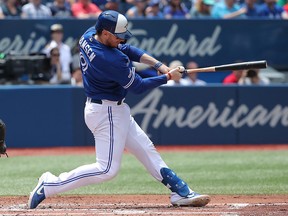 Danny Jansen of the Blue Jays hits an RBI-double against the Arizona Diamondbacks at Rogers Centre on June 9, 2019 in Toronto. (Tom Szczerbowski/Getty Images)