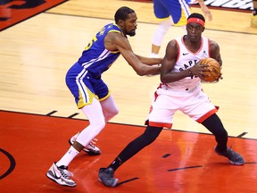 Kevin Durant (left) of the Golden State Warriors guards Pascal Siakam of the Toronto Raptors during Game 5 of the NBA Finals in Toronto on Monday night. (Vaughn Ridley/Getty Images)