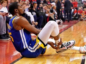 Jun 10, 2019; Toronto, Ontario, CAN; Golden State Warriors forward Kevin Durant (35) sits on the court after an apparent injury during the second quarter in game five against the Toronto Raptors of the 2019 NBA Finals at Scotiabank Arena. Mandatory Credit: Kyle Terada-USA TODAY Sports ORG XMIT: USATSI-404669