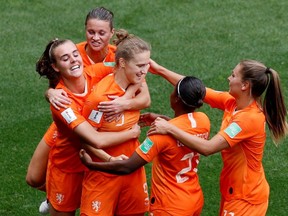 Netherlands players celebrate their third goal against Cameroon at the 2019 FIFA Women's World Cup in Valenciennes, France on June 15, 2019.