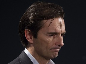 Dallas Eakins speaks to the media on Dec. 16, 2014, a day after he was fired as head coach of the Edmonton Oilers. 
(DAVID BLOOM/Edmonton Sun files)