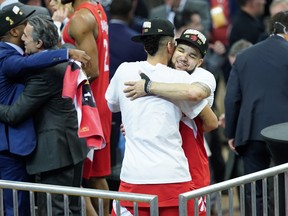 Raptors’ Fred VanVleet hugs teammate Danny Green following Toronto’s victory over the Golden State Warriors to win Game 6 of the NBA Finals and capture the league title on Thursday night in Oakland. (GETTY IMAGES)