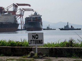 Container ship MV Bavaria (C), a vessel shipping tonnes of trash back to Canada, arrives at Subic Bay International Terminal Corporation on Subic Port, north of Manila, on May 30, 2019. (Noel CELIS/AFP/Getty Images)