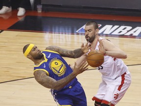 The Raptors’ Marc Gasol (right) battles for the ball with DeMarcus Cousins of the Warriors during the first half of Game 2 
of the NBA Finals on Sunday night at Scotiabank Arena. (Jack Boland /Toronto Sun)