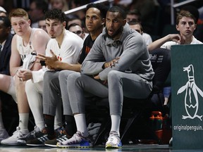 Dewan Hernandez, sitting on the Miami Hurricanes bench as he serves his suspension, was the lone pick of the Raptors in the NBA draft.. (Photo by Michael Reaves/Getty Images)