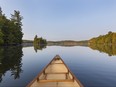 Canoe bow on a Canadian lake in late summer - Haliburton, Ontario