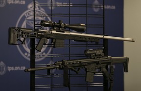 Three men and two women were charged after Toronto Police seized assault weapons, handguns, drugs and cash in January 2017. (Jack Boland/Toronto Sun/Postmedia Network)