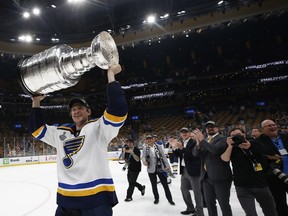 St. Louis Blues defenseman Jay Bouwmeester (19) hoists the Stanley Cup after defeating the Boston Bruins in game seven of the 2019 Stanley Cup Final at TD Garden.