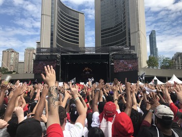 Fans await the Raptors at Nathan Phillips Square on June 17, 2019. (Stan Behal/Toronto Sun)