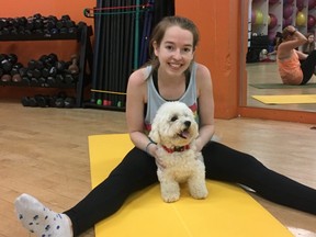 Steph Watkim takes part in a puppy yoga class at Womens Fitness Clubs of Canada in Thornhill to raise funds for the Centre for Addiction and Mental Health