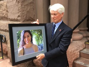 Dan Leckey holds a picture of his daughter, Emma Leckey, outside Old City Hall court on Monday, June 10.
