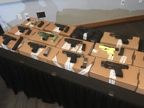 Dozens of firearms seized in Project Kraken were on display during a news conference at headquarters on Friday, June 28, 2019. (Joe Warmington/Toronto Sun/Postmedia Network)