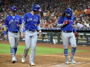 Toronto Blue Jays shortstop Freddy Galvis (right) celebrates after hitting a three run home run against the Houston Astros in the sixth inning at Minute Maid Park. (Thomas B. Shea-USA TODAY Sports)