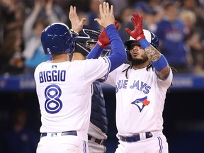 Freddy Galvis of the Toronto Blue Jays is congratulated by Cavan Biggio after hitting a two-run home run against the New York Yankees at Rogers Centre on June 4, 2019 in Toronto. (Tom Szczerbowski/Getty Images)