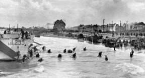 This photo, provided by the Imperial War Museum to AFP/Getty Images, was taken on June 6, 1944, and shows Canadian soldiers from 9th Brigade landing with their bicycles at Juno Beach in Bernieres-sur-Mer as Allied forces storm Normandy beaches in northwestern France on D-Day.