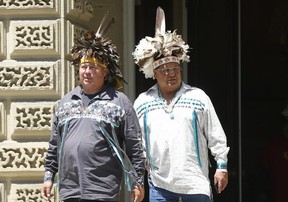 Billionaire Six Nations cigarette businessman Kenneth Hill, right, emerges from the Ontario Appeals court with supporters on Thursday, June 6, 2019. (Jack Boland/Toronto Sun/Postmedia Network)