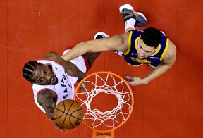 Raptors’ Kawhi Leonard (left) goes to the hoops as Golden State Warriors’ Klay Thompson defends during Game 5 of the NBA Finals on Monday night in Toronto. (USA TODAY)
