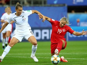 Canada's Adriana Leon in action with New Zealand's Ria Percival at the 2019 FIFA Women's World Cup in Grenoble, France on June 15, 2019.