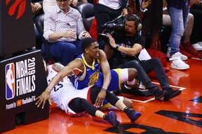 Warriors’ Kevon Looney sustains an injury as he falls to the floor in Game 2 of the NBA Finals. Looney is out for the rest of the series. Vaughn Ridley/Getty Images