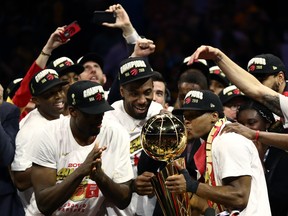 Kyle Lowry kisses the Larry O’Brien Trophy after the Raptors defeated the Golden State Warriors on Thursday night to win their first NBA championship. Lowry was instrumental in the victory, getting off to perhaps the best start of his long career. (Ezra Shaw/Getty Images)