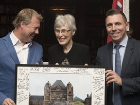Julia Munro, then MPP for York-Simcoe, receives a signed photo of Queen's Park from then PC leader Patrick Brown, right, and Rick Dykstra, President of the Ontario PC Party, in Toronto on Monday March 6, 2017. Submitted