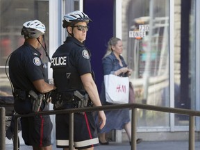 Toronto Police officers were at Charles and Yonge Sts., the scene of the city's 26th murder of the year, on Saturday, June 8, 2019. (Stan Behal/Toronto Sun/Postmedia Network)