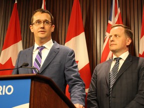 Ontario Infrastructure Minister Monte McNaughton (left) and Transportation Minister Jeff Yurek (right) speak at a news conference on Monday, June 3, 2019. (Antonella Artuso/Toronto Sun/Postmedia Network)