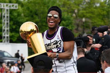 Toronto Raptors guard Kyle Lowry holds the Larry O'Brien NBA Championship Trophy during Raptors victory parade celebration in Toronto, June 17, 2019.   REUTERS/Moe Doiron