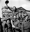 Sergeant Karen M. Hermeston of the Canadian Army Film and Photo Unit during the VJ-Day celebrations in Picadilly Circus, London, England, Aug. 10, 1945. (PHOTO BY LIEUT. KEN BELL/DEPT. OF NATIONAL DEFENCE / LIBRARY AND ARCHIVES CANADA)