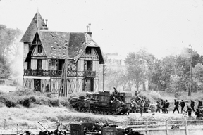 One of the more iconic photos shot by Lieutenant Gilbert “Gib” Milne from Landing Craft LCI306 captured what would become Canada House at Bernieres-sur-Mer. (DEPT. OF NATIONAL DEFENCE / LIBRARY AND ARCHIVES CANADA)