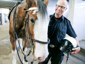 Joel Houston of the Toronto Police Mounted Unit with a new horse named Picard on Thursday, June 13, 2019. (Veronica Henri/Toronto Sun/Postmedia Network)