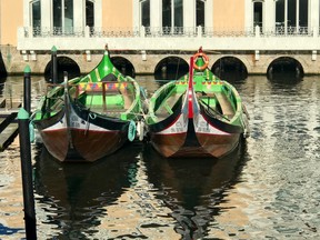 Boats once used to collect seaweed are now used to take tourists for rides in Aveiro, Portugal, a scenic seaside town with a network of canals. (PAT LEE)