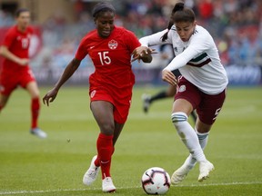 Team Mexico's defender Jimena Lopez vies for the ball from Team Canada's Nichelle Prince (15) during the first half of a women's international soccer friendly against Mexico at BMO Field in Toronto, Saturday, May 18, 2019.