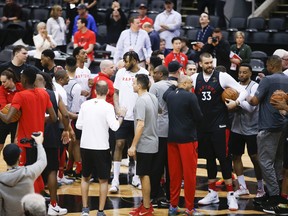 Raptors players gather at centre court after practice in Toronto on Saturday. Game 2 goes Sunday night. (JACK BOLAND/TORONTO SUN)