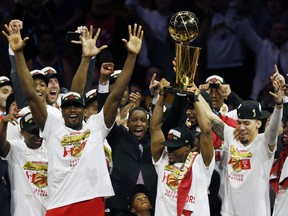 The Toronto Raptors celebrates with the Larry O'Brien Championship Trophy after they defeated the Golden State Warriors last night at Oracle Arena. (Getty Images)