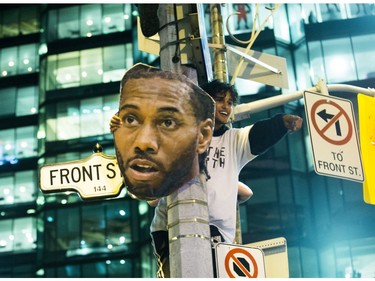 Fans fill the streets of downtown Toronto, Ont. celebrating the Toronto Raptors victory over the Golden State Warriors in the NBA Finals on Friday June 14, 2019.