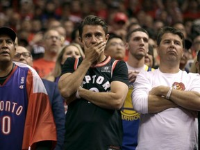 Toronto Raptors fans look glum towards the end of the fourth quarter during Game 5 NBA Finals action against Golden State Warriors at the Scotiabank Arena in Toronto, Ont. on Monday June 10, 2019.