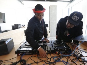 DJ Romeo, left, with DJ Grouch at the newly- unveiled Remix Project state of the art centre in the Daniels Waterfront - City of The Arts building on Queens Quay East on Tuesday June 11, 2019.