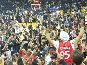 Raptors superfan Nav Bhatia celebrates Toronto's win Friday night over the Golden State Warriors in Oakland, California