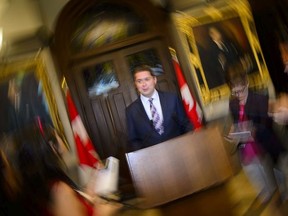 CP-Web.  Conservative Leader Andrew Scheer talks to the media in the foyer of the House of Commons on Parliament Hill, in Ottawa on Monday, June 10, 2019.